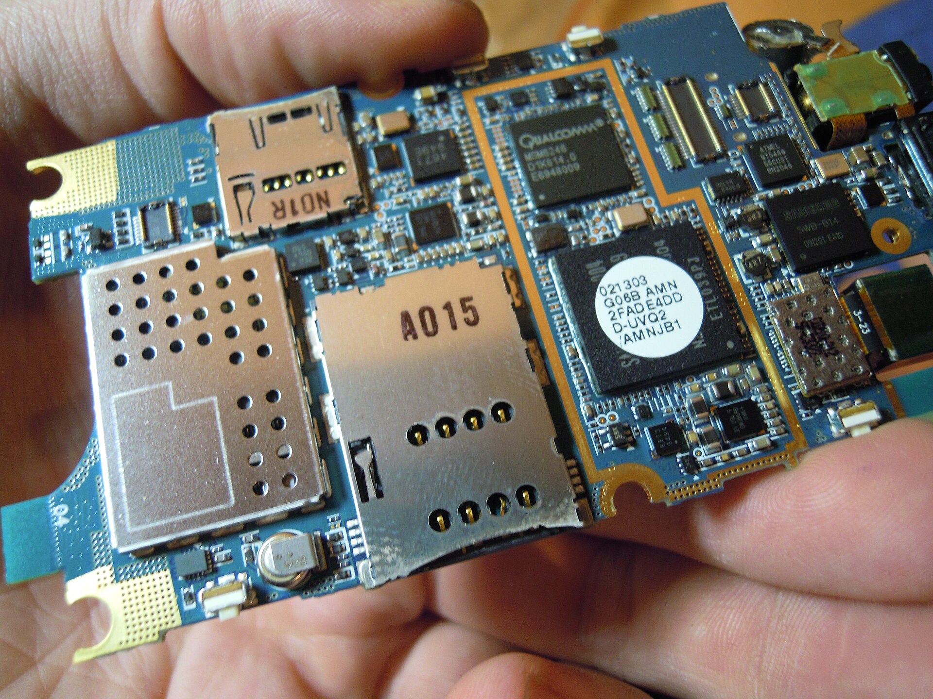 A smartphone logic board, where on-device AI models actually run